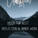 Cold moon reflecting winter lake.